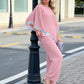 Set aus elegantem Poncho-Oberteil mit Paillettenbesatz und weit geschnittener Hose