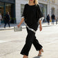 Set aus elegantem Poncho-Oberteil mit Paillettenbesatz und weit geschnittener Hose